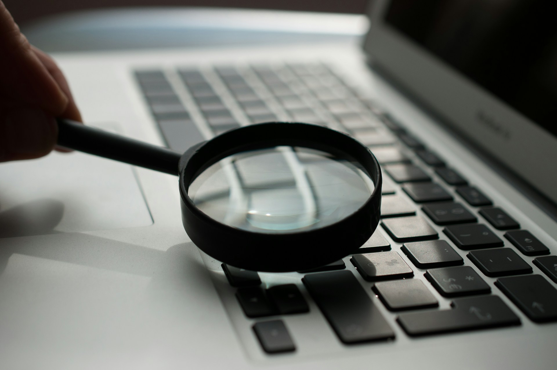 A magnifying glass over a keyboard