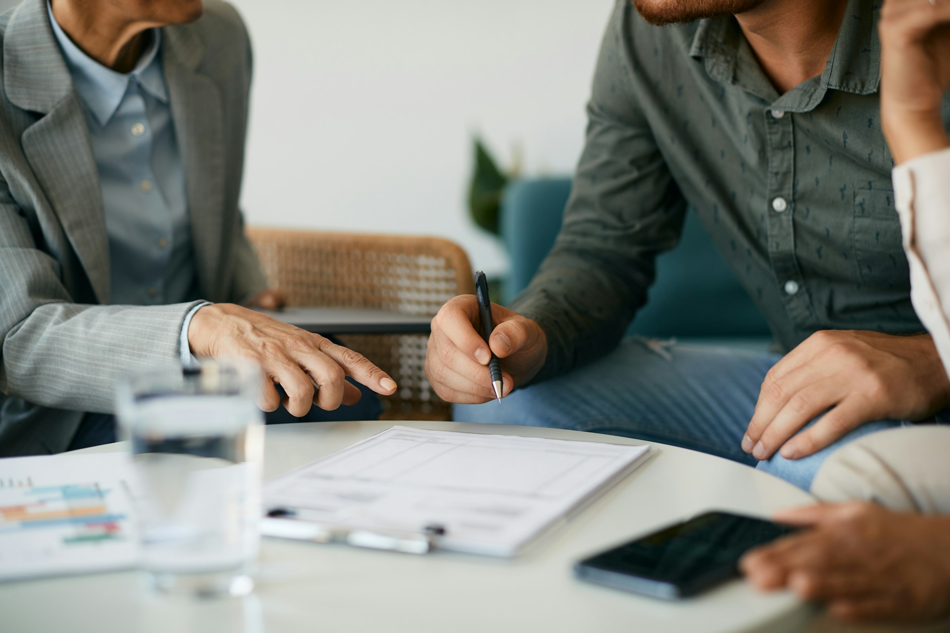 A consultant going over paperwork with his client